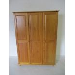 A pine triple wardrobe