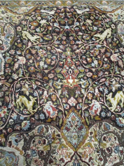 A black ground carpet with floral design, animals etc. approx 12ft x 8ft 10 inches - Image 5 of 8
