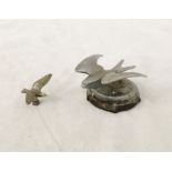 A vintage Art Deco car radiator cap in the form a swallow, along with one other