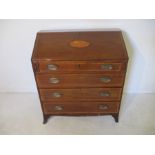 A Georgian bureau with inlaid shell decoration