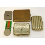 Various silver plated cigarette cases and a WWII medal