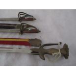 Three Indian swords, two in scabbards