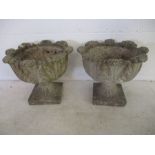 A pair of reconstituted stone garden urns