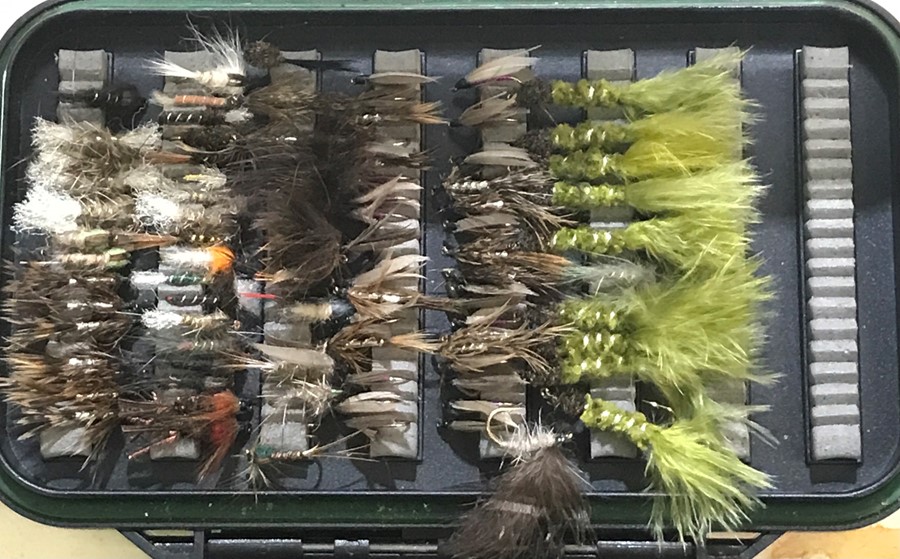 A box of fishing flies