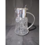 A silver plated cut glass jug with removable glass ice compartment