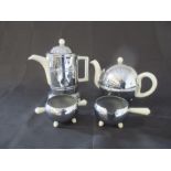 A Heatmaster style chrome and ceramic four piece tea/coffee set