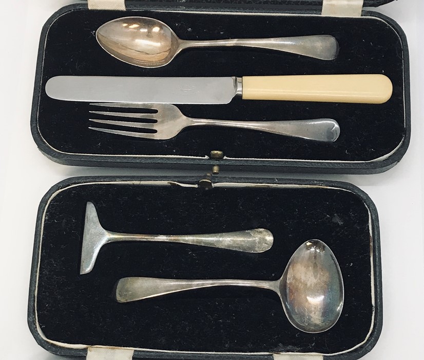 A hallmarked silver Christening set along with a cased silver feeding set