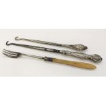 Two silver handled button hooks & a silver pickle fork