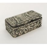 A small hallmarked silver pill box ( Chester 1900, George Nathan & Ridley Hayes) decorated with a