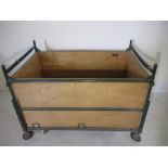 A stackable four wheeled industrial trolley. Length 127cm width 80cm Height 95cm