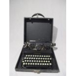 A vintage Corona typewriter in carry case