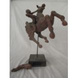 A large terracotta figure group of horse and rider by Julian Sainsbury, 1990 on stone plinth. Tail