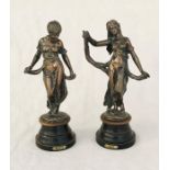 A pair of French bronze figures entitled "Modiste" and "Caiete"