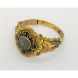 An 18ct gold Georgian mourning ring with enamelled detailing, repaired
