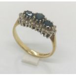 A 9 ct gold diamond and sapphire dress ring