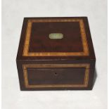 An Edwardian mahogany box with inlay detail, plaque to top bearing the date 1905.