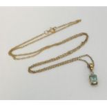A 9 ct gold pendant set with an aquamarine on a fine 9ct gold chain