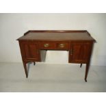 An Edwardian inlaid writing desk with single drawer and two cupboards