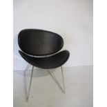 An Eames style black & chrome chair
