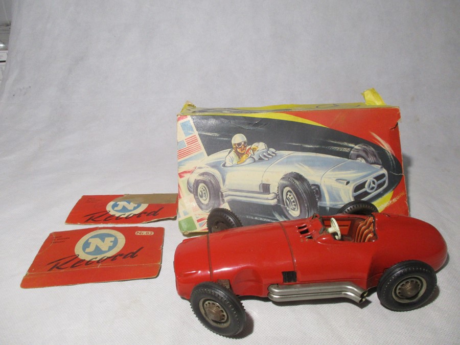 A vintage Mercedes Benz friction driven, tin plate model racer, Made in West Germany by NF. Car No