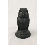 A Black Forest carved owl inkwell with glass eyes and hinged head