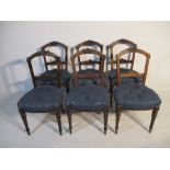 A set of six Victorian dining chairs with buttoned seats