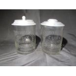 Two similar Carr's Biscuits glass storage jars