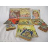 A collection of Shirley Temple books including "Poor Little Rich Girl", "Now I am Eight", "Stowaway"