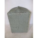 A Lloyd Loom linen basket with shaped top
