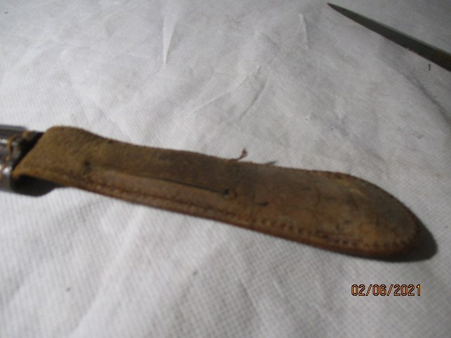 A Fairbairn Sykes fighting knife in leather scabbard, the blade engraved Wilkinson Sword, London - Image 11 of 11