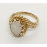 A 9ct gold ring set with an opal