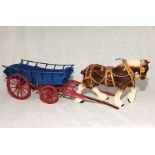 A ceramic shire horse with matching wooden cart