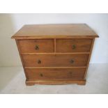 A small pitch pine chest of four drawers