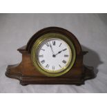 An Edwardian mantle clock with Roman numerals on a white enamelled dial