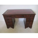 A reproduction kneehole desk