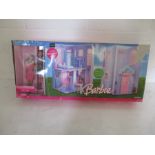 A boxed Barbie "City Pretty Townhouse and Dolls" gift set by Mattel.