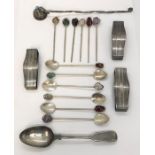 A collection of silver items including Sterling napkin rings, spoons etc.