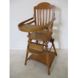 A vintage metamorphic child's highchair