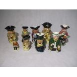 A collection of nine various sized Toby Jugs, included one by Beswick