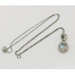 An 18ct white gold pendant set with an aquamarine along with a fine 18ct gold chain, total weight