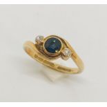 An 18ct gold ring with sapphire and diamonds