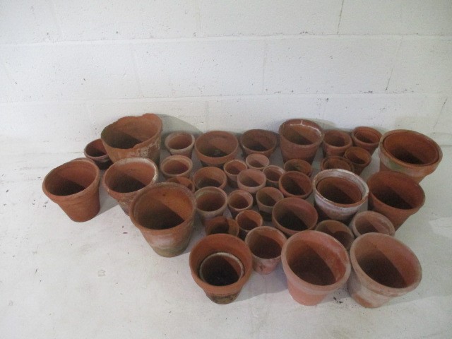 A large collection of terra cotta pots.