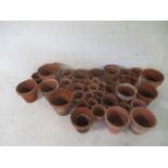 A large collection of terra cotta pots.