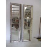 Two French shutter doors with mirrored panels