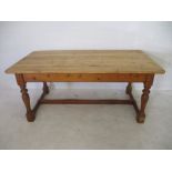 A pine farmhouse table - height 79cm, length 183cm, depth 92cm