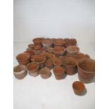 A large collection of terracotta pots.