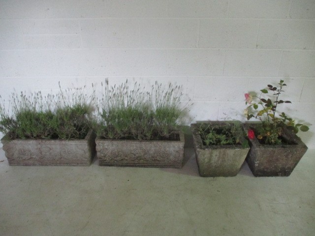 Two concrete garden pots, along with a pair of concrete troughs
