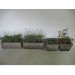 Two concrete garden pots, along with a pair of concrete troughs