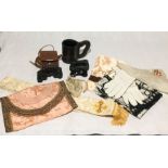 A collection of various items including binoculars, scarves,a leather jack, handkerchiefs etc