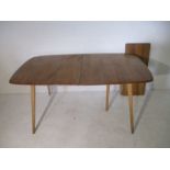 An Ercol extending dining table with folding leaf